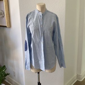 Stand color blue button down shirt